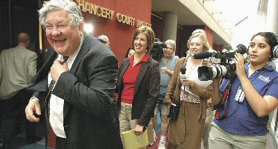 Knoxville attorney Herbert S. Moncier shows his joy at the jury verdict as the media wait to talk with him outside Chancery Court on Tuesday afternoon. Moncier represented nine Knox County citizens in the suit over the sunshine law. Photo by J. Miles Cary / Knoxville News Sentinel