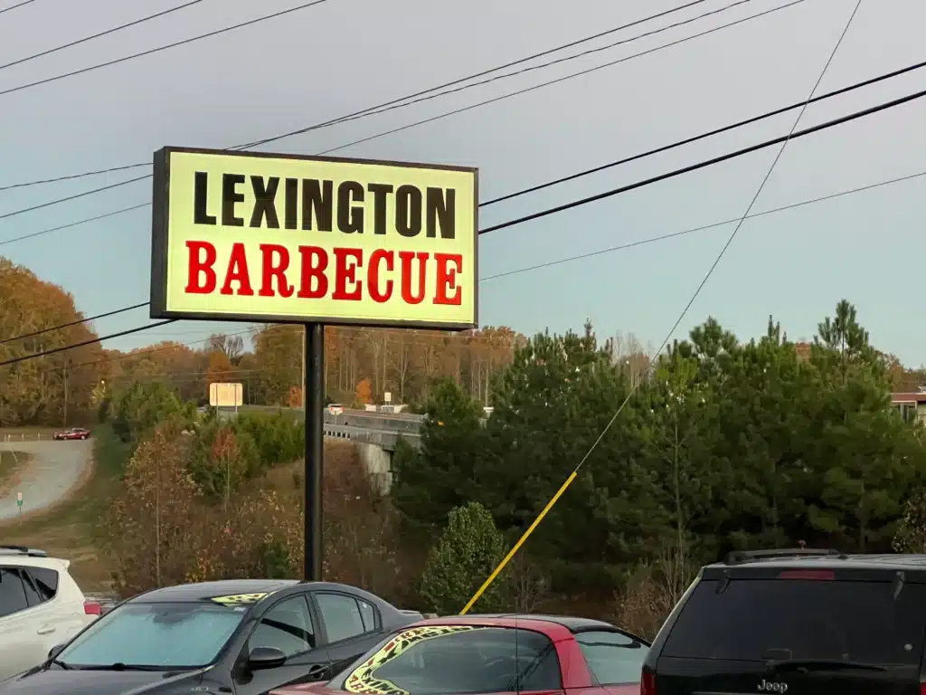 The sign in the parking lot for Lexington BBQ.